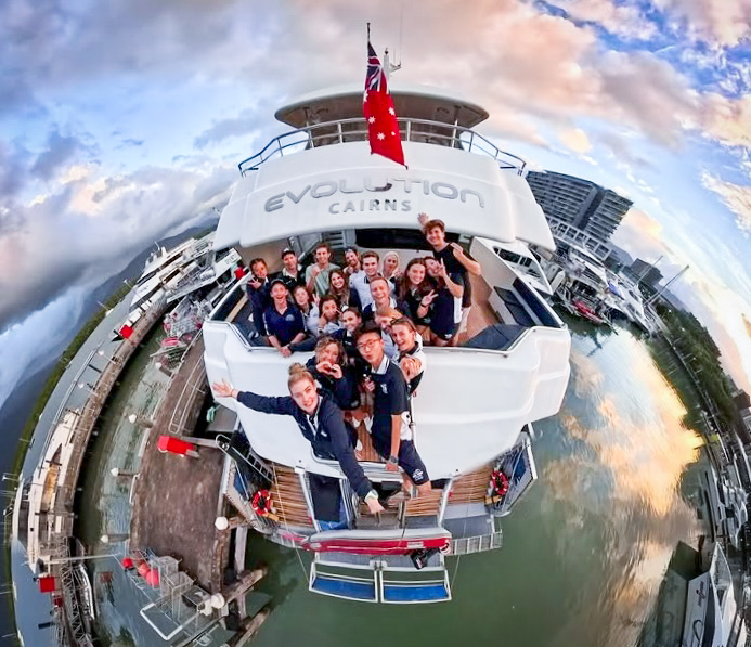 The Evolution crew gathered on the back deck of the boat in Cairns